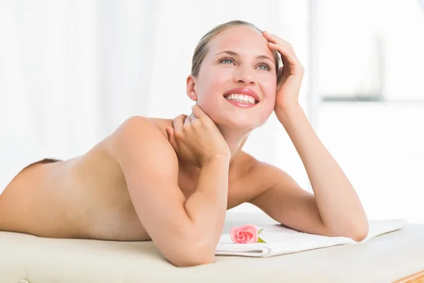 Peaceful blonde lying on towel smiling — Stock Photo, Image