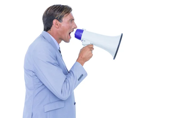 Businessman talking through megaphone — Stock Photo, Image