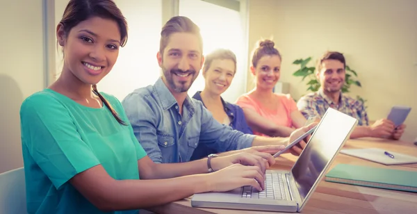 Creative business team smiling at camera — Stock Photo, Image