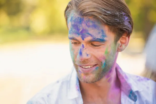 Young man having fun with powder paint — Stock Photo, Image