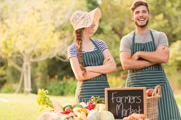 Happy farmers standing arms crossed — Stock Photo, Image