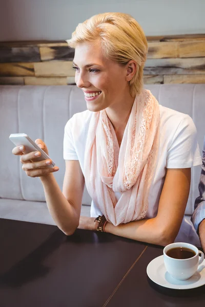 Young woman texting with her friend — Stock Photo, Image