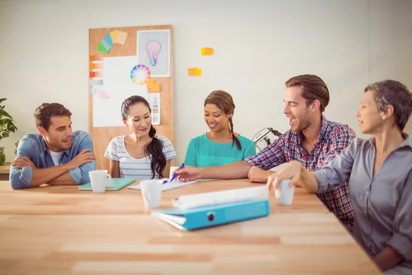Seated creative business team working together — Stock Photo, Image