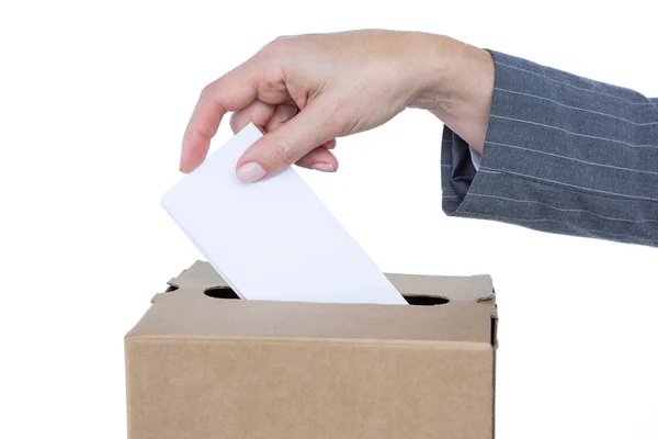 Businessman putting ballot in vote box — Stock Photo, Image