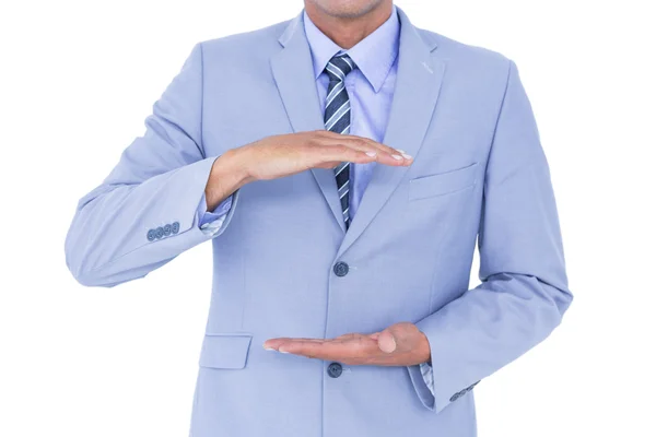 Handsome businessman gesturing with hands — Stock Photo, Image