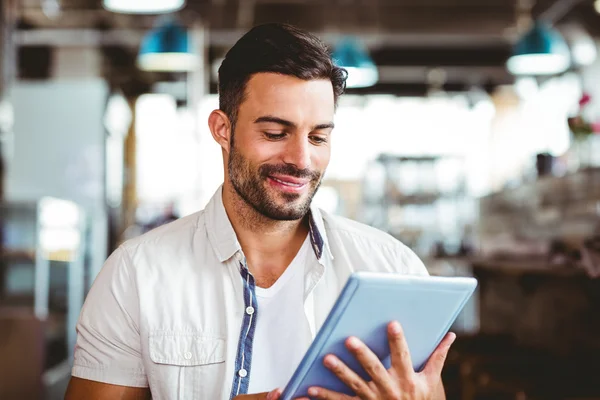 Man having cup of coffee using tablet — Stock Photo, Image