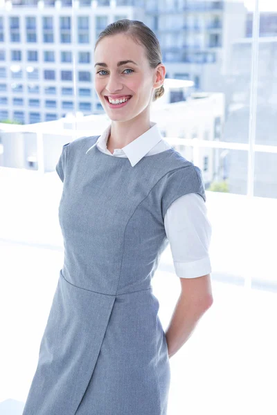 Businesswoman smiling at the camera — Stock Photo, Image