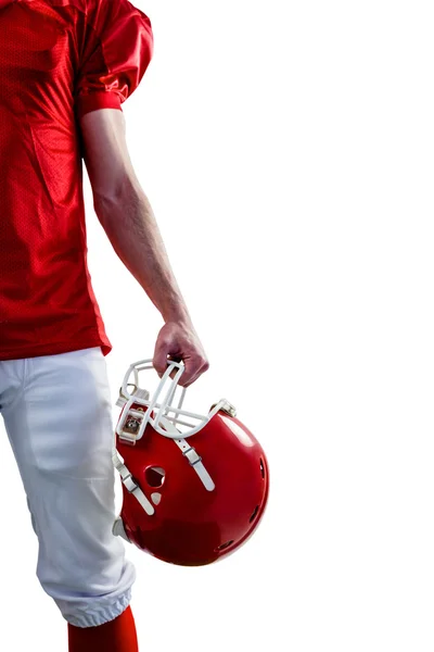 Jugador de fútbol tomando su casco en la mano — Foto de Stock