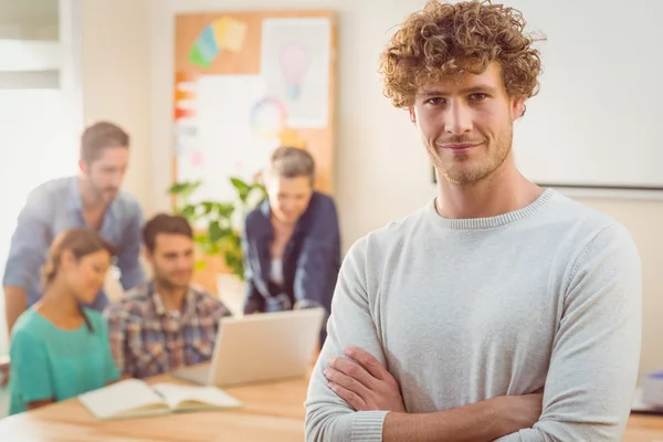 Portrait of a man with his colleague behind him — Stock Photo, Image