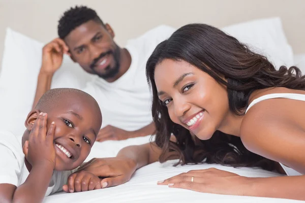 Happy family on the bed — Stock Photo, Image