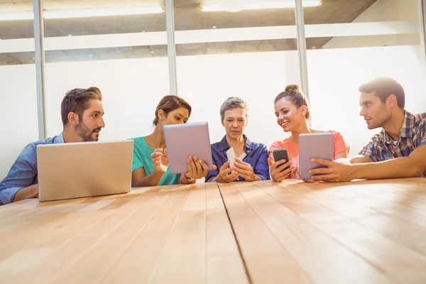 Creative colleagues with laptop and digital tablet — Stock Photo, Image