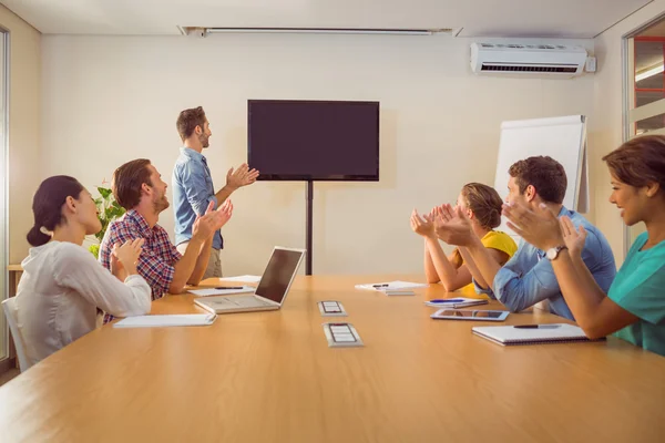 Attentive business team applausing after a conference — Stock Photo, Image