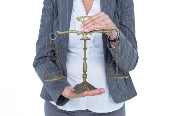 Businesswoman holding scales of justice — Stock Photo, Image
