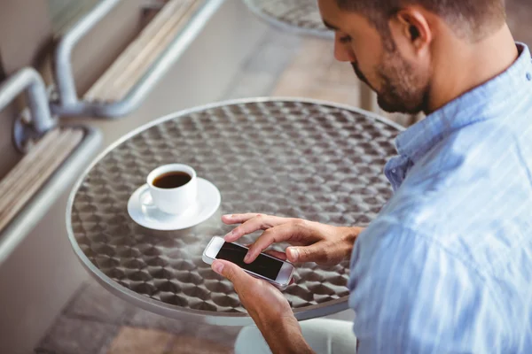 Attentive businessman sending text message — Stock Photo, Image