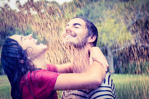 couple hugging under the rain