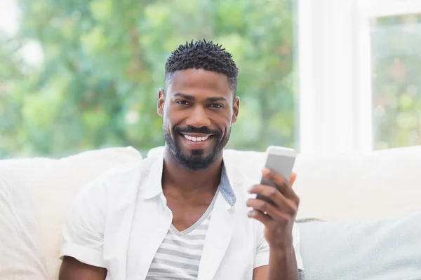 Casual man using his smartphone