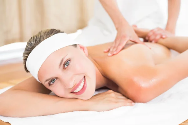 Blonde enjoying a massage smiling — Stock Photo, Image