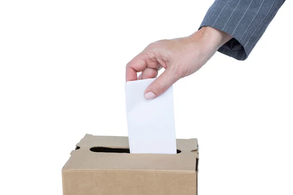 Businessman putting ballot in vote box — Stock Photo, Image