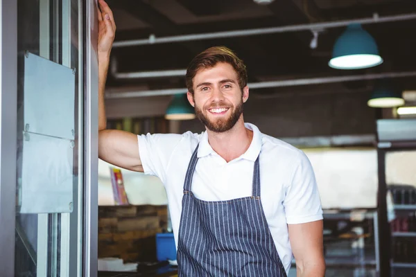 Smiling server in apron — Stock Photo, Image