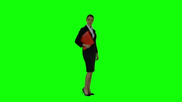 Businesswoman looking to the camera with file — Stock Video