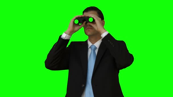 Businessman looking through binoculars — Stock Video