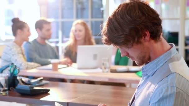 Businessman using tablet with his colleagues — Stock Video