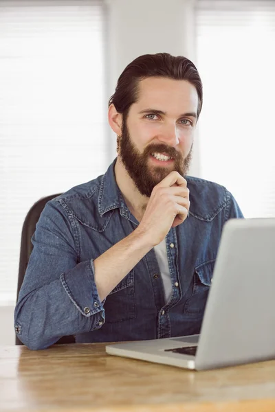 Hipster businessman working on his laptop — Stock Photo, Image