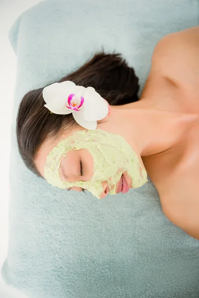 Woman having green cream on face — Stock Photo, Image