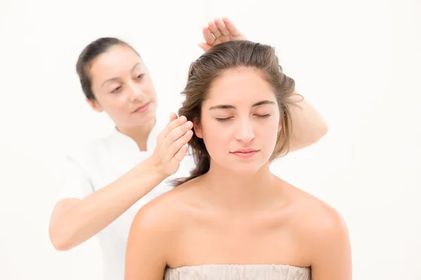 Beautician touching hair of woman — Stock Photo, Image