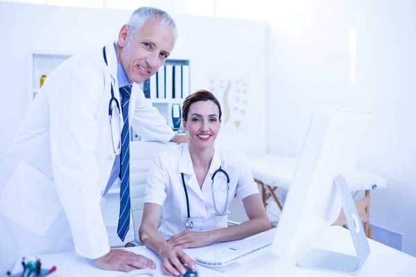 Medical colleagues working with computer — Stock Photo, Image