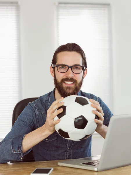 Hipster businessman holding a football — ストック写真