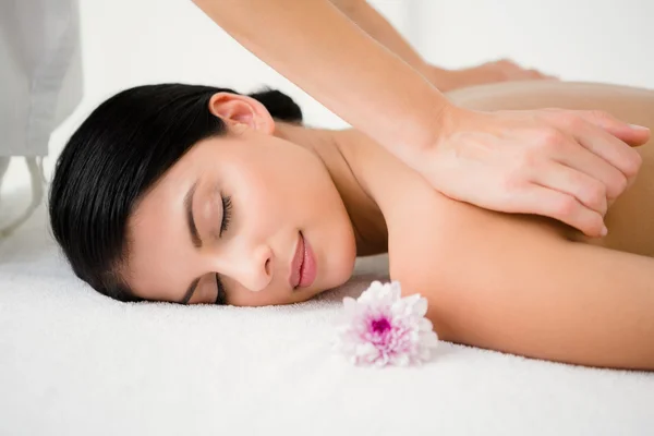 Brunette enjoying massage — Stock Photo, Image