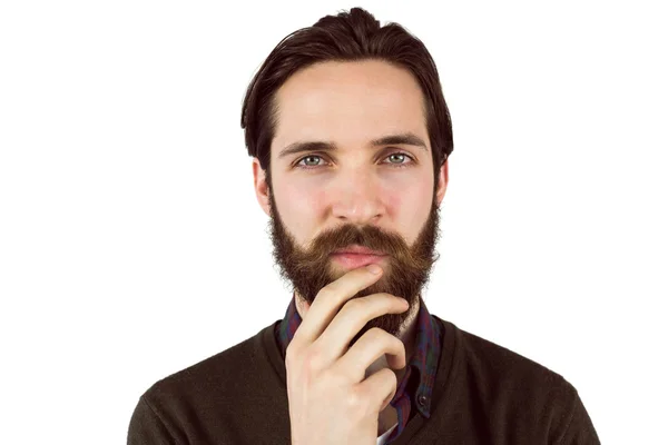 Hipster thinking with hand on chin — Stock Photo, Image