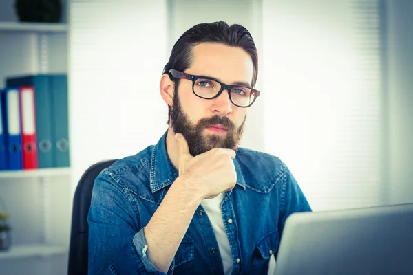 Hipster businessman working on his laptop — Stock Photo, Image