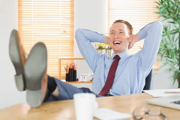 Relaxed businessman with his feet up — Stock Photo, Image