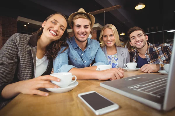 Smiling friends having coffee together — Stock Photo, Image