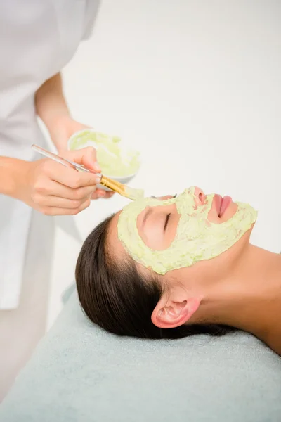 Attractive woman receiving treatment at spa center — Stock Photo, Image