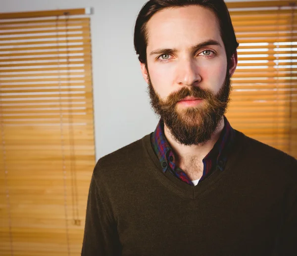 Hipster businessman frowning at camera — Stock Photo, Image