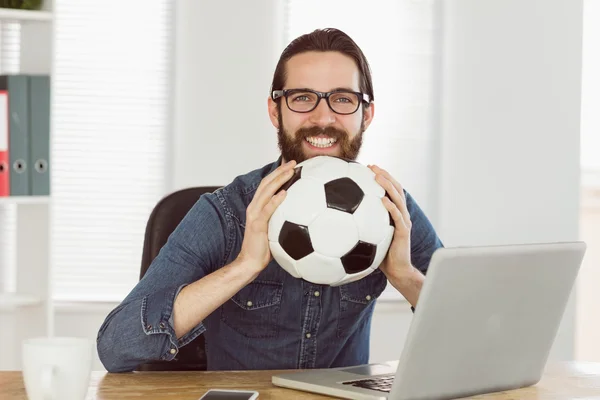 Hipster businessman holding a football — Stok fotoğraf
