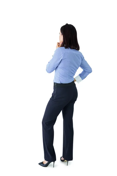 Businesswoman standing and thinking — Zdjęcie stockowe