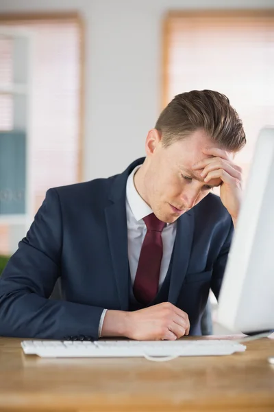 Worried businessman working at his desk — Stock Photo, Image