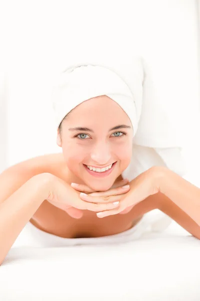 Woman on massage table at spa center — Stock Photo, Image