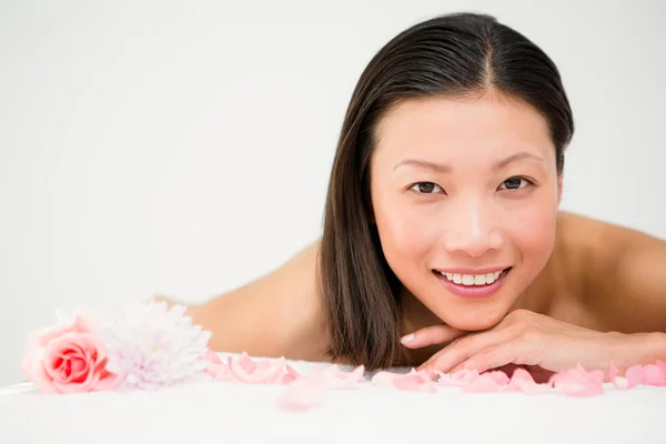 Relaxed woman lying on massage table — Stock Photo, Image