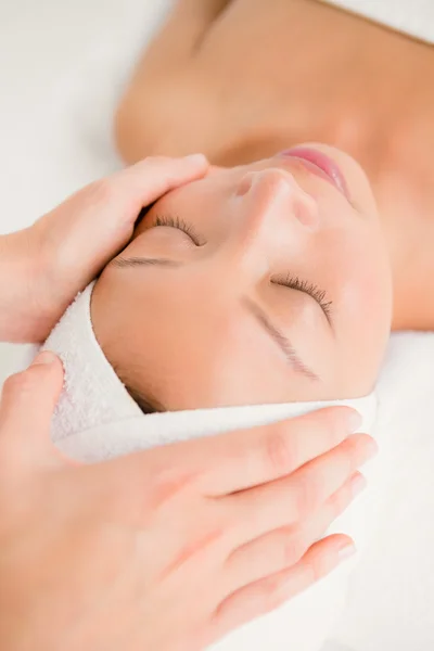 Woman receiving forehead massage — Stock Photo, Image