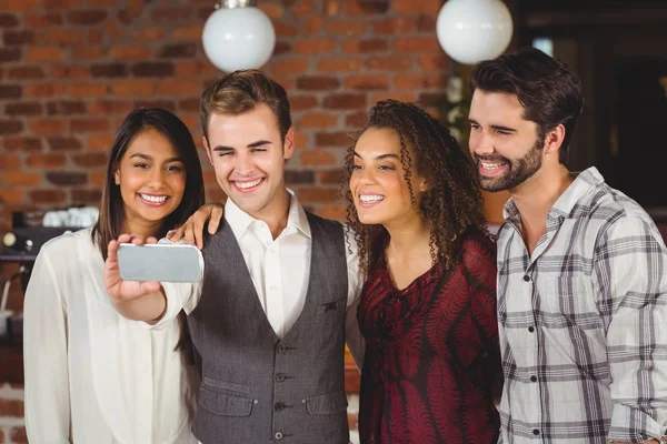 Smiling friends taking a selfie together — Stock Photo, Image