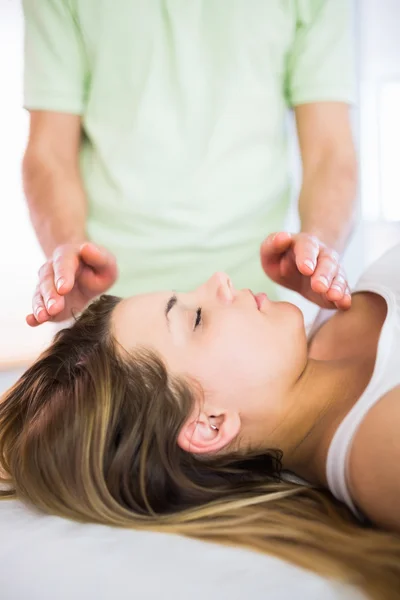 Close up view of relaxed pregnant woman getting reiki treatment — 图库照片