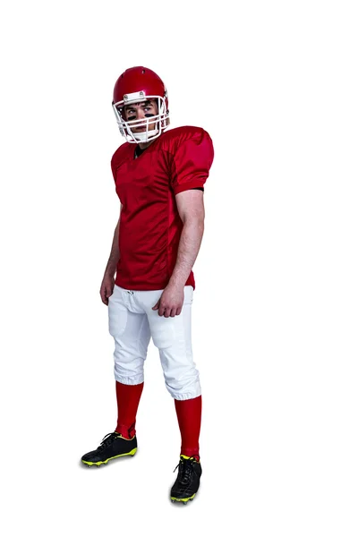 Serious american football player wearing a helmet — Stock Photo, Image