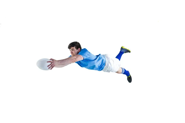 Un jugador de rugby anotando un intento — Foto de Stock