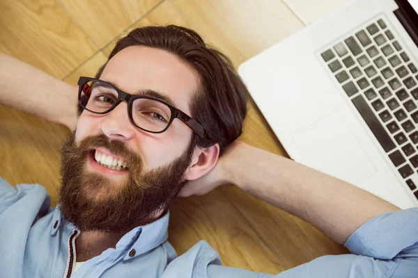 Handsome hipster using his laptop — Stock Photo, Image