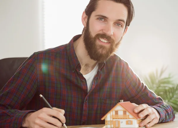 Hipster businessman applying for a mortgage — Stockfoto